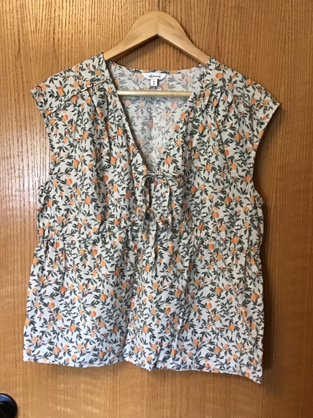 Women's adorable Cream, orange and green print Tie-Front Sleeveless Top